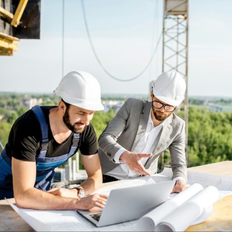 Engineer with worker at the construction site